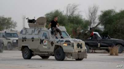 Joint forces affiliated with Libya's Government of National Unity, assemble inside the closed Tripoli International Airport as they deploy on the outskirts and entrances of the capital Tripoli, on August 16, 2022. (Photo by Mahmud Turkia / AFP)