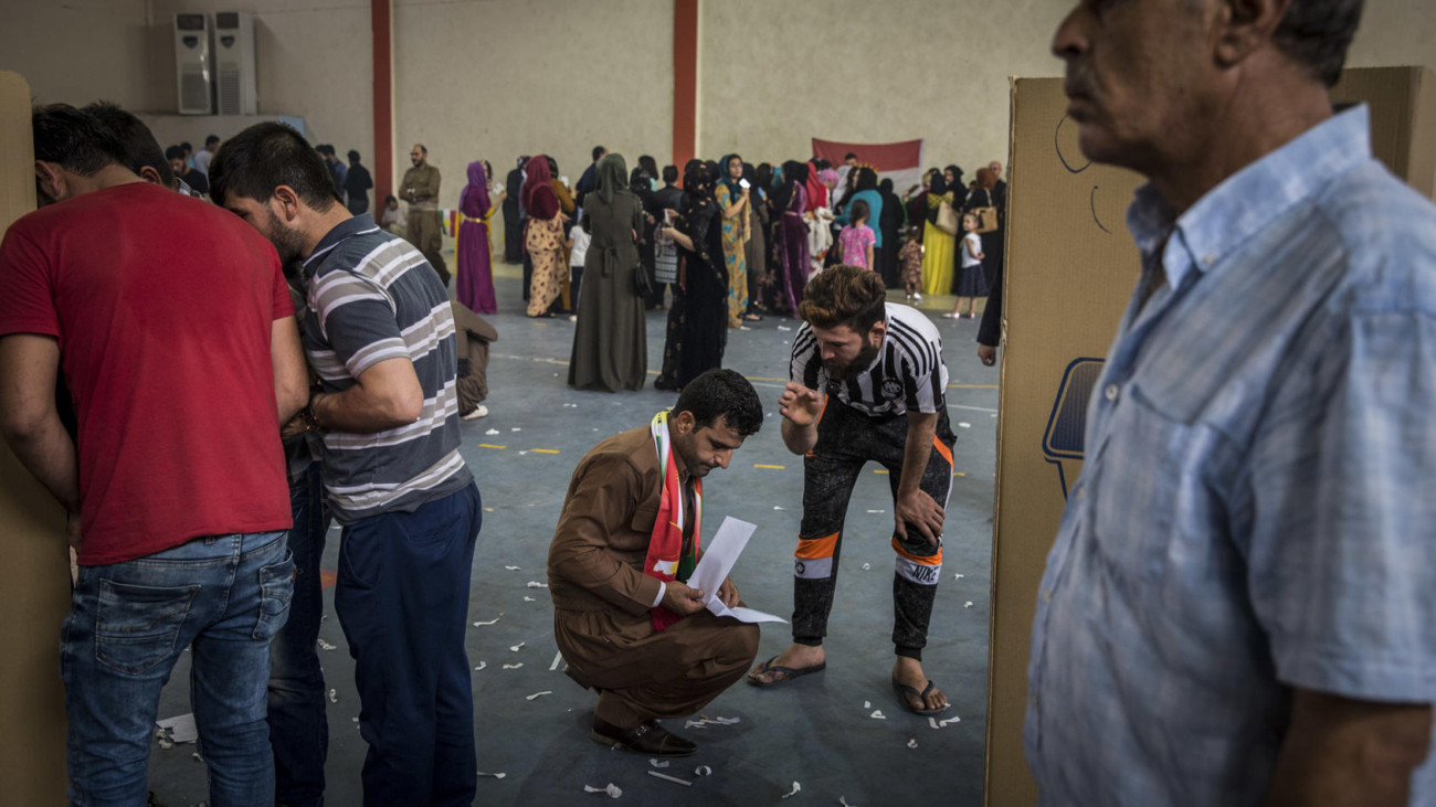 People vote in a referendum on independence, in a sports hall set up at a voting center in Irbil, Iraq, Sept. 25, 2017. Kurds across northern Iraq lined up Monday to vote in a referendum on whether to seek independence for an autonomous Kurdish region that has yearned for nationhood for more than a century.  Officials said results would be announced within 72 hours. But Iraq considers the vote illegal, and Iran and Turkey are also opposed. (Ivor Prickett/The New York Times)