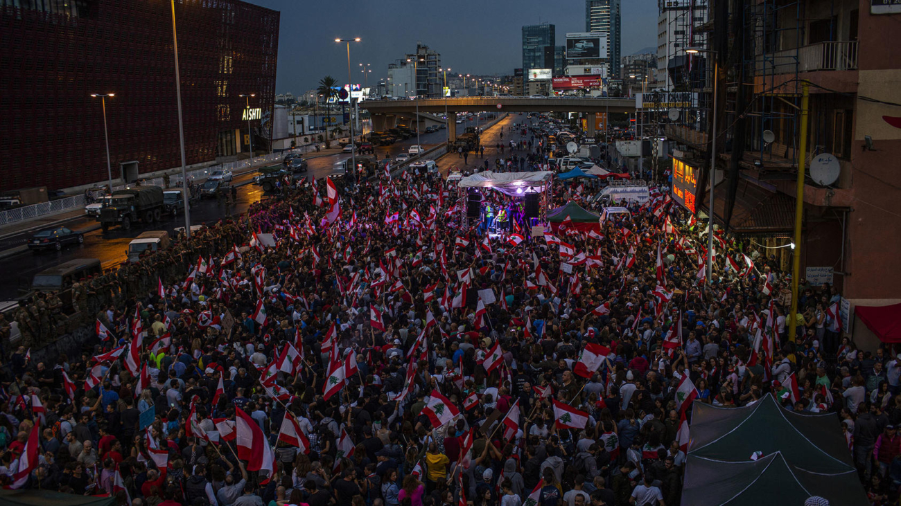 Thousands of people protesting corruption and the government's inability to provide basic services in Beirut on Oct. 23, 2019. The country's government is rooted in an agreement that ended Lebanon’s civil war nearly 30 years ago and has enriched the political elite while failing to build a stable economy or provide basics like reliable running water or consistent waste management. (Diego Ibarra Sanchez/The New York Times)