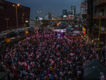 Thousands of people protesting corruption and the government's inability to provide basic services in Beirut on Oct. 23, 2019. The country's government is rooted in an agreement that ended Lebanon’s civil war nearly 30 years ago and has enriched the political elite while failing to build a stable economy or provide basics like reliable running water or consistent waste management. (Diego Ibarra Sanchez/The New York Times)