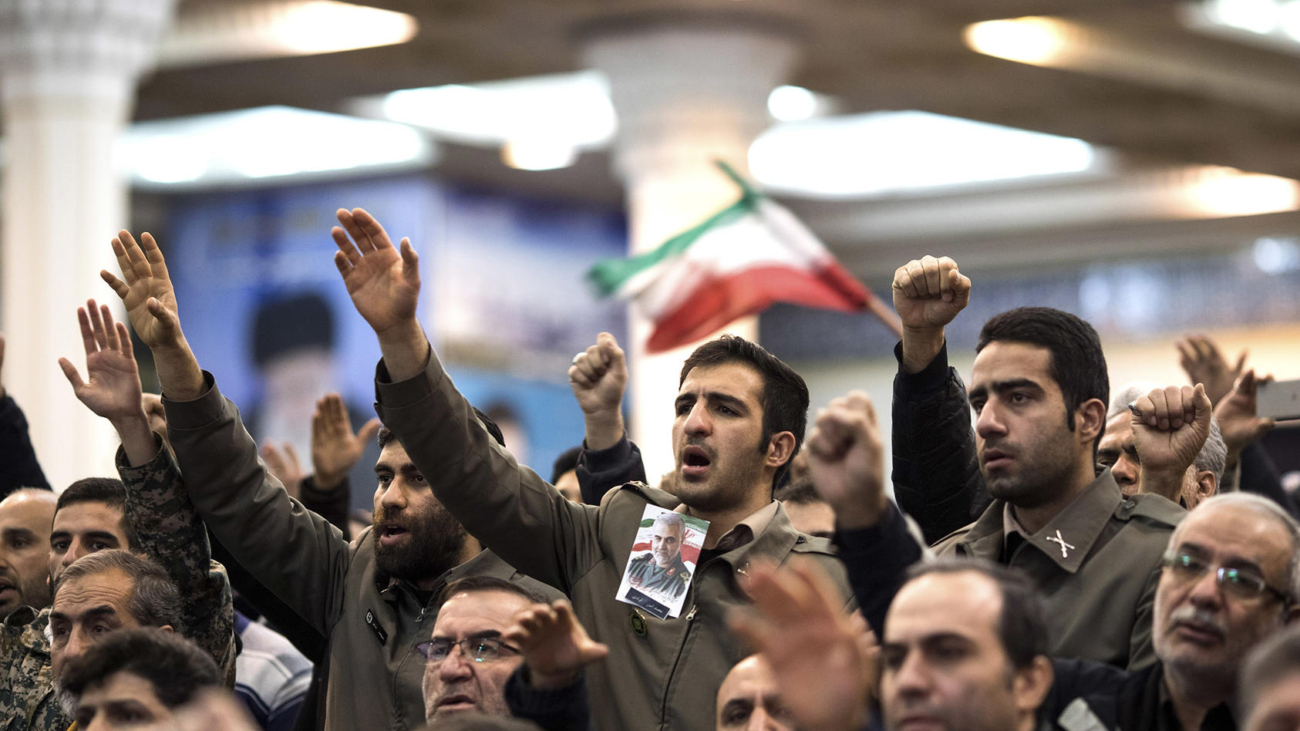 FILE -- People gathered with an image of Gen. Qassem Soleimani to mourn his loss in Tehran, Jan. 5, 2020. The Trump administration escalated pressure on Iran to try to negotiate over its nuclear aims. Instead, Iran fought back with violent attacks. At critical points, each country misjudged the other. (Arash Khamooshi/The New York Times)