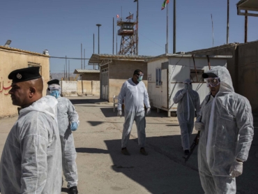 Iraqi border police at the Zurbatiya border crossing with Iran, Monday, March 9, 2020. Most Iranians have been banned from entering Iraq for the last three weeks and on Sunday, Iraq will temporarily shut all land border crossings outside of Iraqi Kurdistan for two weeks. (Ivor Prickett/The New York Times)