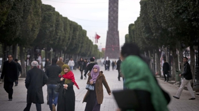 People walk along Avenue Habib Bourguiba in downtown Tunis, Tunisia, Feb. 11, 2013. The avenue, named for Tunisia's first post-independence leader, has absorbed more than a century of Tunisia's struggles; and in its best moments, the avenue forges a community even when the country seems at odds. (Tara Todras-Whitehill/The New York Times)