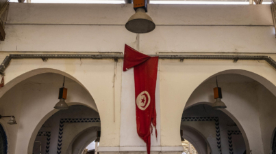 A tattered Tunisian flag at the Marche Central, a market in downtown Tunis, Tunisia, Sept. 28, 2021. Tunisia, birthplace of the pro-democracy uprisings that swept the Arab world, now looks to many like a final confirmation of failed promise. (Ivor Prickett/The New York Times)