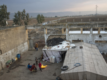 Syrian refugees live in a factory bombed by the Israeli military in 1982 near Faida, Lebanon, Nov. 14, 2013. Citing the country's tortured history with Palestinian refugees, Lebanon has not established camps for Syrians, leaving many in ad-hoc "urban refugee" situations where they have proven particularly difficult to reach with aid.(Lynsey Addario/The New York Times) -- NO SALES.