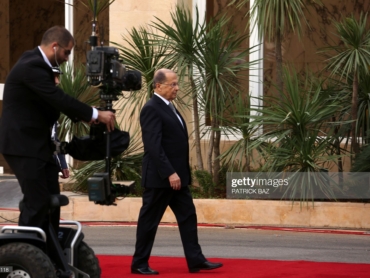 Lebanese president-elect Michel Aoun walks on the red carpet as he arrives at the presidential palace in Baabda, east of Beirut, on October 31, 2016, after he was elected ending a political vacuum of more than two years.


The deeply divided parliament took four rounds of voting to elect Aoun, whose supporters flooded streets and squares across the country to celebrate his victory. / AFP / PATRICK BAZ        (Photo credit should read PATRICK BAZ/AFP via Getty Images)